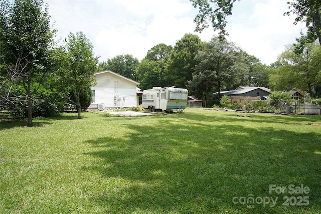 3974 Pleasant Plains Rd, Matthews, NC 28104 - view of yard with an outdoor structure and view of wooded area