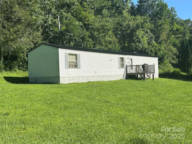 492 Chestnut Mountain Rd, Spruce Pine, NC 28777 - view of front of house with a deck and a front yard