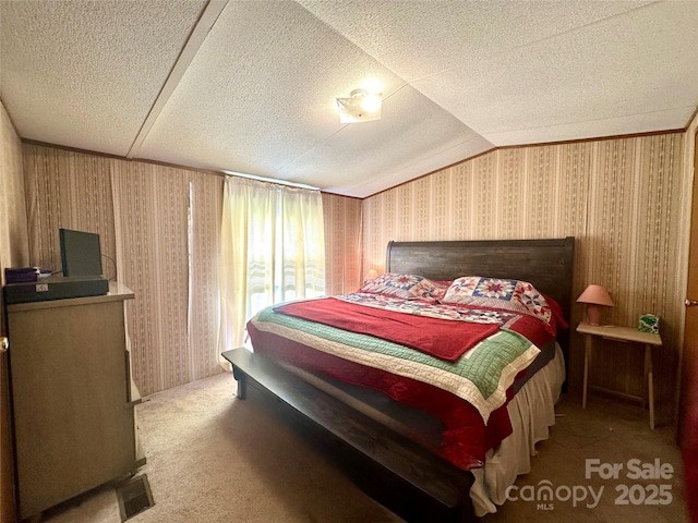 492 Chestnut Mountain Rd, Spruce Pine, NC 28777 - bedroom with carpet, wallpapered walls, a textured ceiling, and vaulted ceiling