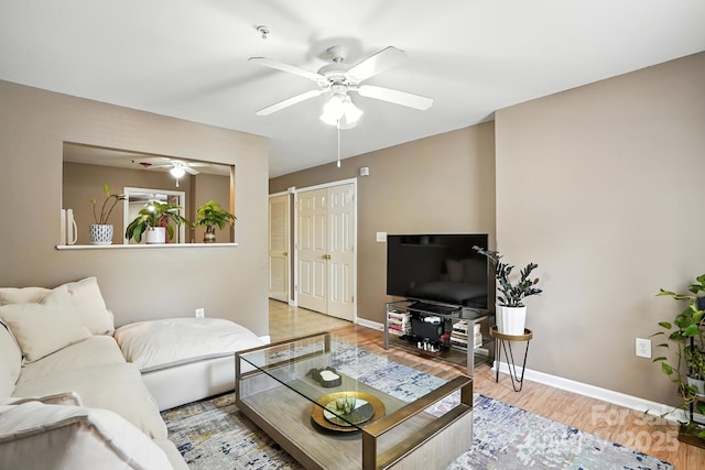 113 Steam Engine Dr Unit 108, Mooresville, NC 28115 - living room with a ceiling fan and light wood-style floors