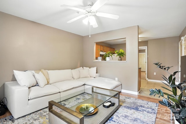 113 Steam Engine Dr Unit 108, Mooresville, NC 28115 - living room with a ceiling fan and light wood-style floors