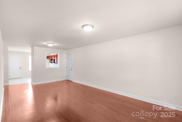 169 Abigail Ln, Locust, NC 28097 - empty room with light wood-style flooring and baseboards