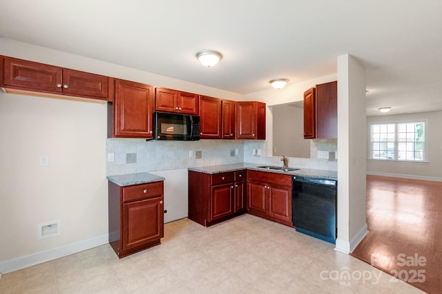 169 Abigail Ln, Locust, NC 28097 - kitchen featuring black appliances, backsplash, and light stone countertops