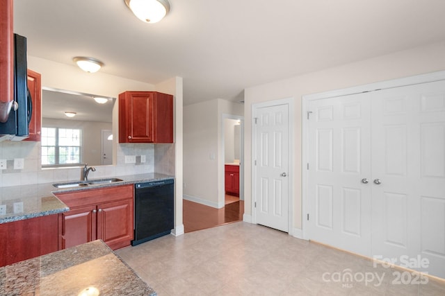 169 Abigail Ln, Locust, NC 28097 - kitchen featuring tasteful backsplash, black dishwasher, and light stone counters