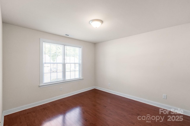 169 Abigail Ln, Locust, NC 28097 - unfurnished room with dark wood finished floors and baseboards