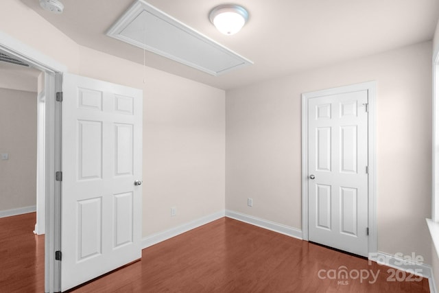 169 Abigail Ln, Locust, NC 28097 - unfurnished bedroom with attic access and wood finished floors