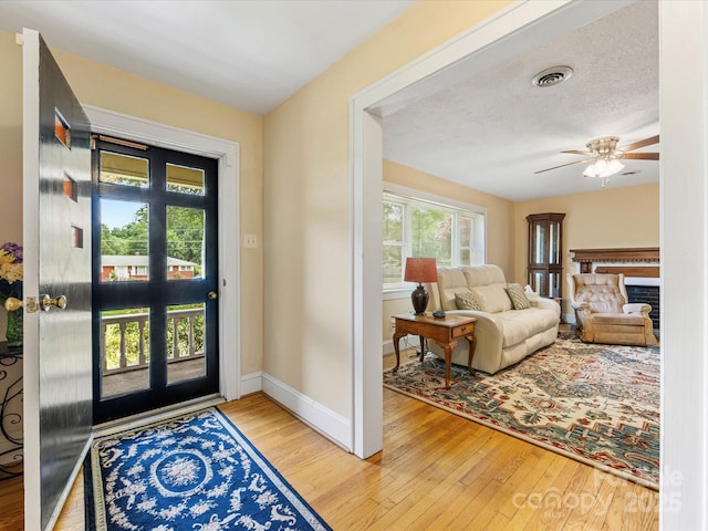 209 11th St, Spencer, NC 28159 - foyer entrance with wood-type flooring and a ceiling fan
