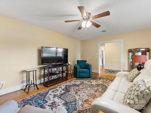 209 11th St, Spencer, NC 28159 - living room featuring wood finished floors and ceiling fan