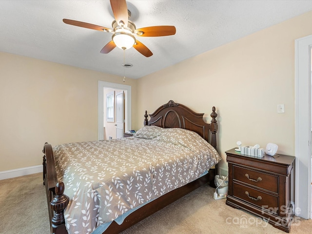 209 11th St, Spencer, NC 28159 - carpeted bedroom featuring baseboards and ceiling fan