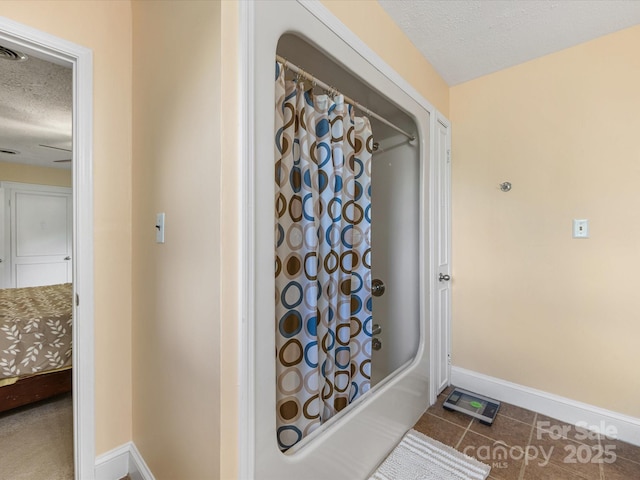 209 11th St, Spencer, NC 28159 - full bath with a textured ceiling, shower / tub combo, and tile patterned floors