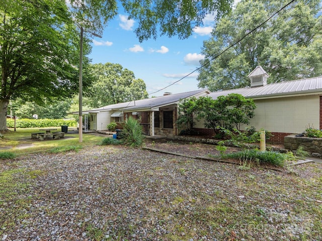 209 11th St, Spencer, NC 28159 - rear view of property with a metal roof