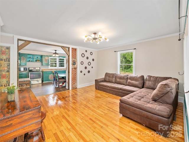 1767 N 226th Hwy, Bakersville, NC 28705 - living area featuring a chandelier, crown molding, and wood finished floors