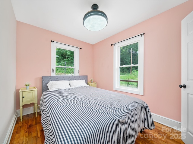 1767 N 226th Hwy, Bakersville, NC 28705 - bedroom featuring multiple windows and wood finished floors