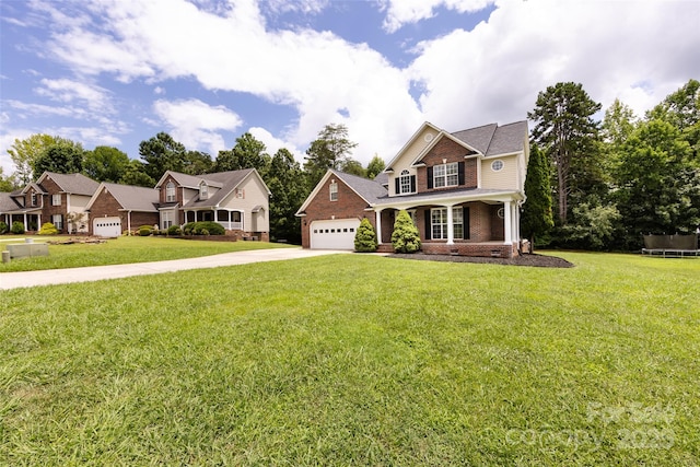 1309 Stonewyck Dr, Salisbury, NC 28146 - view of front of house with driveway, brick siding, a front lawn, and covered porch
