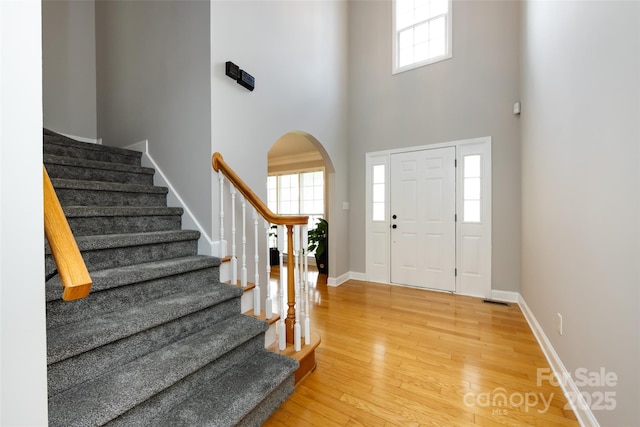 1309 Stonewyck Dr, Salisbury, NC 28146 - entryway with arched walkways, healthy amount of natural light, stairway, and a towering ceiling