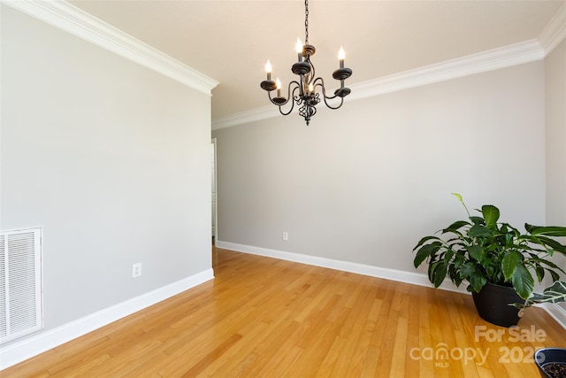 1309 Stonewyck Dr, Salisbury, NC 28146 - unfurnished room featuring a chandelier, crown molding, and light wood-style flooring
