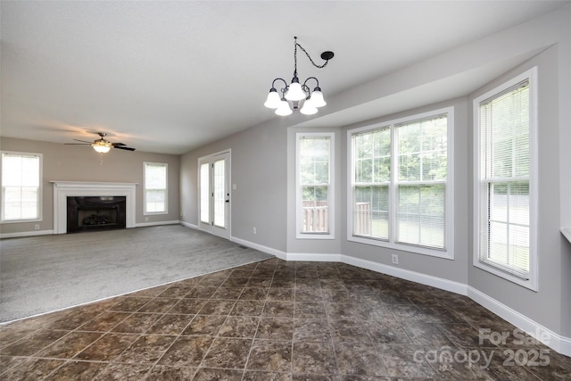 1309 Stonewyck Dr, Salisbury, NC 28146 - unfurnished living room with dark colored carpet, a fireplace, ceiling fan, and a chandelier
