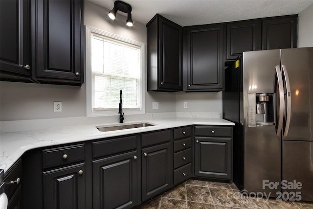1309 Stonewyck Dr, Salisbury, NC 28146 - kitchen featuring stainless steel refrigerator with ice dispenser and light stone counters
