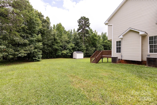 1309 Stonewyck Dr, Salisbury, NC 28146 - view of green lawn featuring a shed, stairs, and a deck