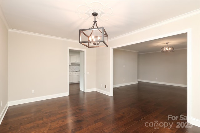 4350 Old Saybrook Ct, Charlotte, NC 28211 - spare room with a chandelier, dark wood-style flooring, and ornamental molding