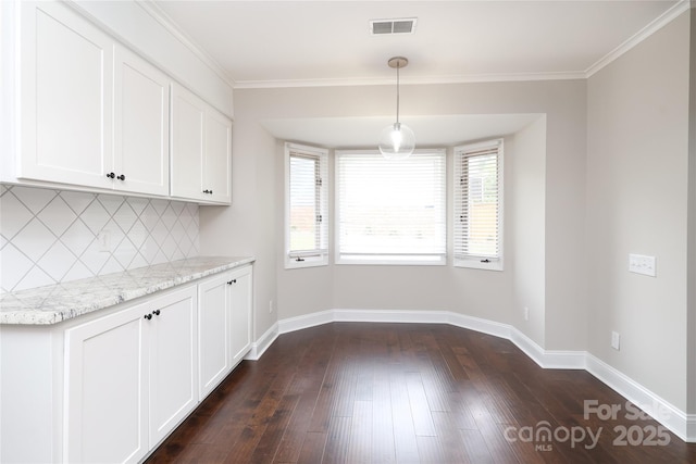 4350 Old Saybrook Ct, Charlotte, NC 28211 - unfurnished dining area featuring dark wood-style floors and crown molding