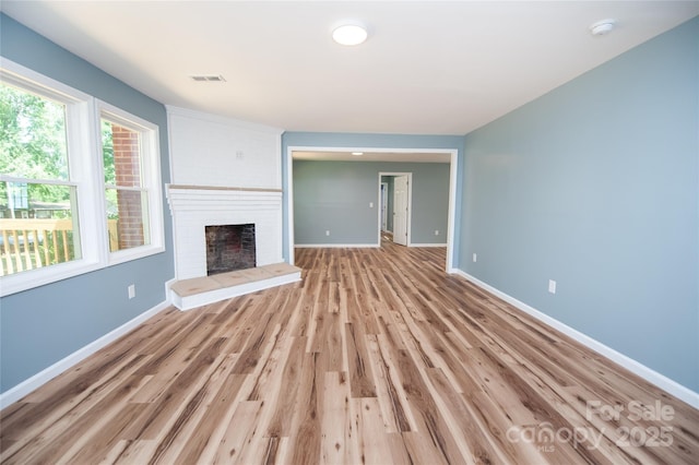 113 Oakleaf Dr, Landrum, SC 29356 - unfurnished living room with a fireplace and light wood-type flooring