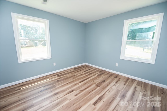 113 Oakleaf Dr, Landrum, SC 29356 - spare room featuring healthy amount of natural light and wood finished floors