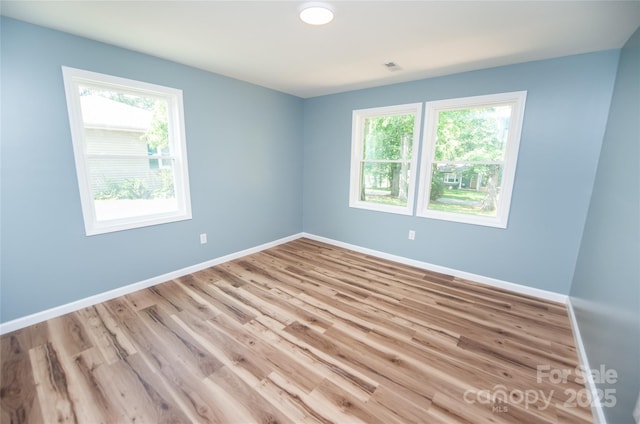 113 Oakleaf Dr, Landrum, SC 29356 - unfurnished room with plenty of natural light and wood finished floors