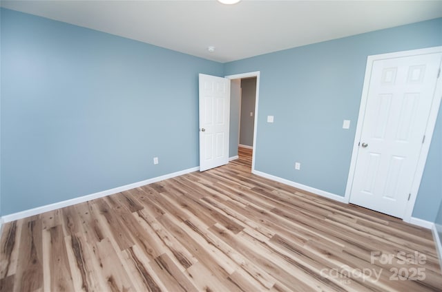 113 Oakleaf Dr, Landrum, SC 29356 - unfurnished bedroom featuring light wood-style floors and baseboards
