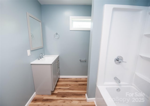 113 Oakleaf Dr, Landrum, SC 29356 - bathroom with vanity, wood finished floors, and tub / shower combination