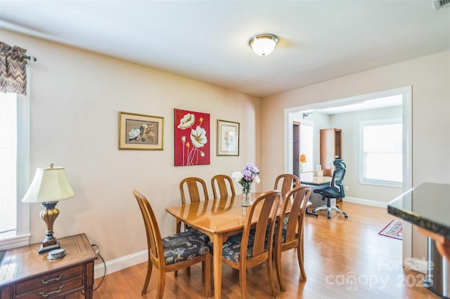 211 Abee St, Morganton, NC 28655 - dining room with light wood-style floors and baseboards