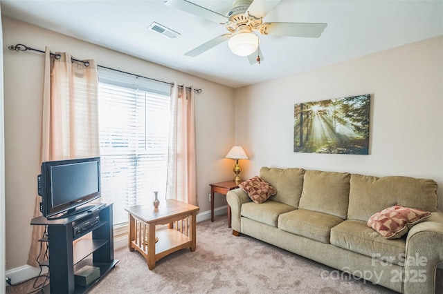 211 Abee St, Morganton, NC 28655 - carpeted living area with ceiling fan and baseboards