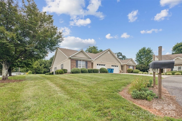 211 Abee St, Morganton, NC 28655 - view of front of property with an attached garage, a front yard, and driveway