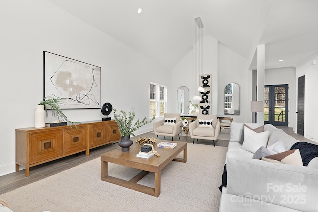 3830 Mill Run, Terrell, NC 28682 - living area featuring plenty of natural light, wood finished floors, high vaulted ceiling, recessed lighting, and french doors