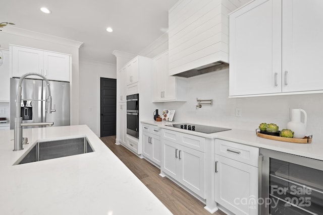 3830 Mill Run, Terrell, NC 28682 - kitchen featuring wine cooler, ornamental molding, light countertops, white cabinets, and wood finished floors