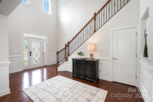 3021 Henshaw Rd, Waxhaw, NC 28173 - foyer with wood finished floors, a high ceiling, stairway, a decorative wall, and a wainscoted wall