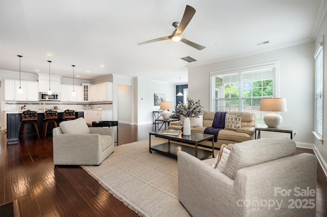 3021 Henshaw Rd, Waxhaw, NC 28173 - living area featuring ornamental molding, ceiling fan, plenty of natural light, dark wood-style floors, and recessed lighting