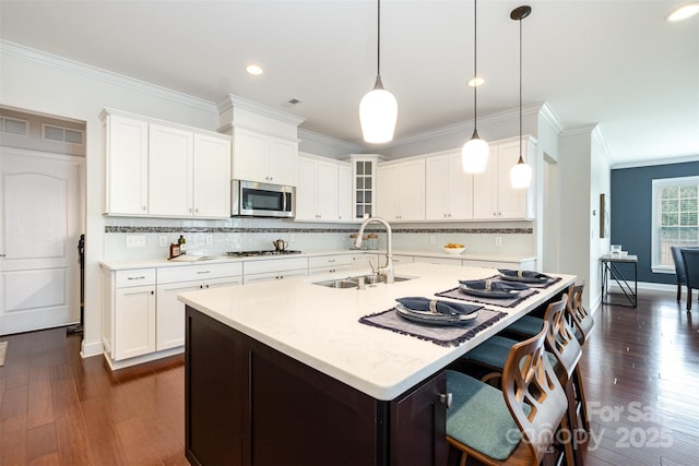 3021 Henshaw Rd, Waxhaw, NC 28173 - kitchen with light countertops, crown molding, decorative backsplash, dark wood finished floors, and glass insert cabinets