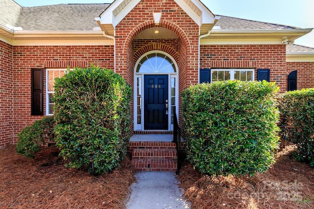 444 Cottonfield Cir, Waxhaw, NC 28173 - property entrance featuring brick siding and a shingled roof