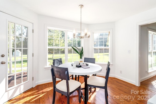 444 Cottonfield Cir, Waxhaw, NC 28173 - dining space with a chandelier and wood finished floors