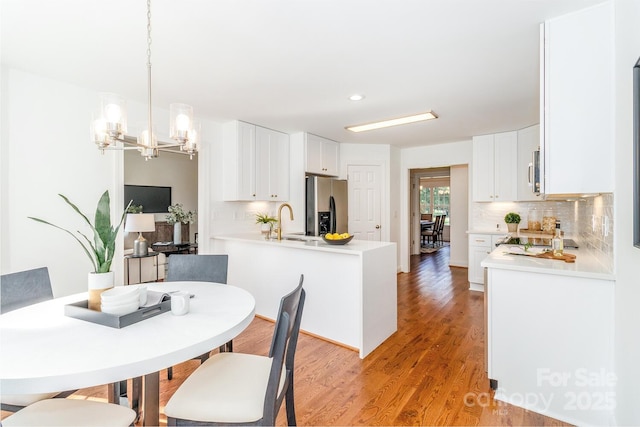444 Cottonfield Cir, Waxhaw, NC 28173 - dining space featuring a chandelier, light wood-style flooring, and recessed lighting