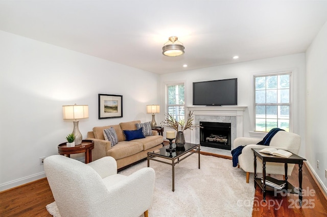 444 Cottonfield Cir, Waxhaw, NC 28173 - living room with wood finished floors, plenty of natural light, a premium fireplace, and recessed lighting