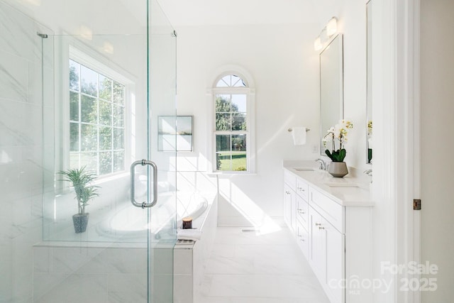 444 Cottonfield Cir, Waxhaw, NC 28173 - full bathroom featuring double vanity, marble finish flooring, a garden tub, and a shower stall