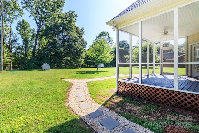 444 Cottonfield Cir, Waxhaw, NC 28173 - view of green lawn featuring ceiling fan, a wooden deck, and a shed