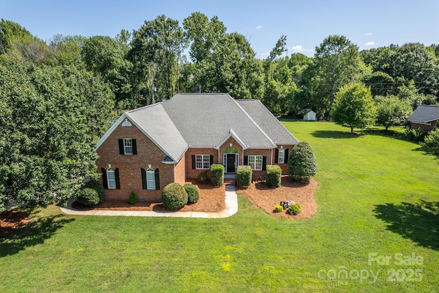 444 Cottonfield Cir, Waxhaw, NC 28173 - view of front facade featuring a front yard and brick siding