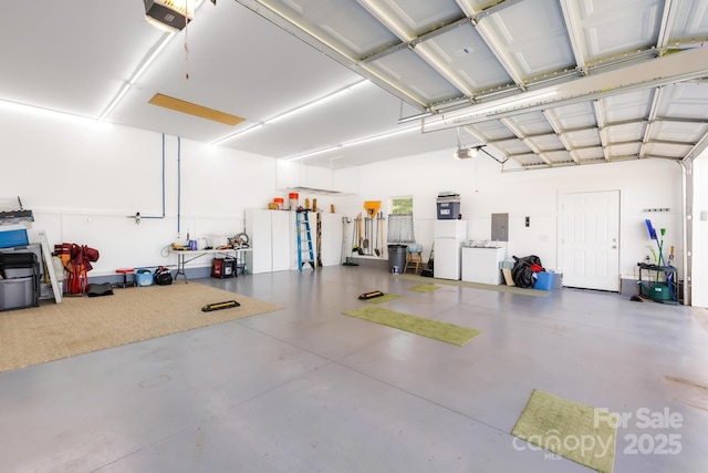 240 Red Cedar Rd, Mooresville, NC 28115 - garage with freestanding refrigerator, a garage door opener, and electric panel