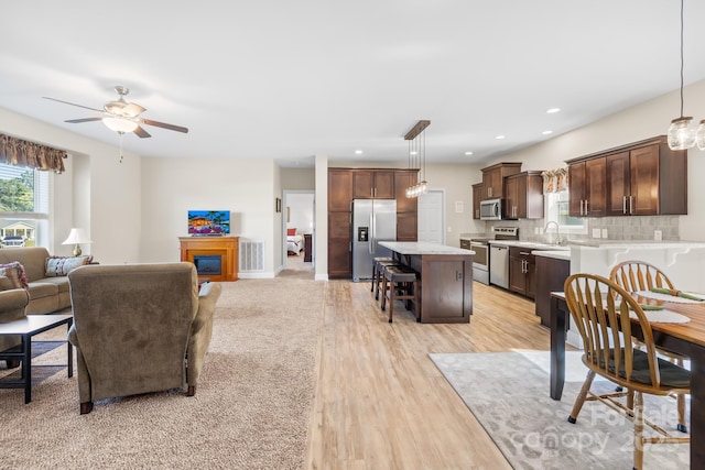 240 Red Cedar Rd, Mooresville, NC 28115 - living area with ceiling fan, light wood finished floors, and recessed lighting