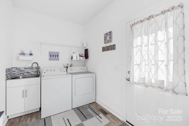 240 Red Cedar Rd, Mooresville, NC 28115 - washroom with washer and clothes dryer, cabinet space, and wood finished floors