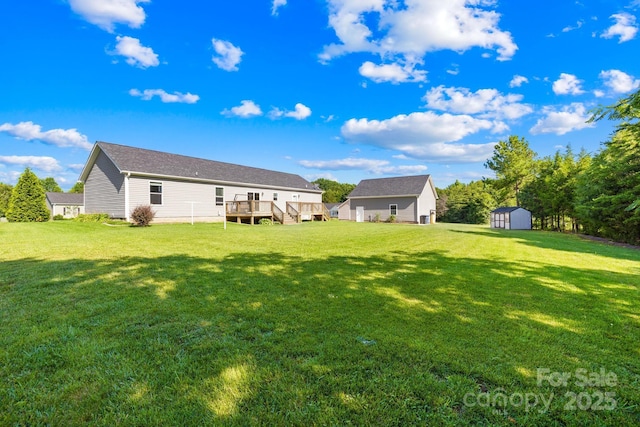 240 Red Cedar Rd, Mooresville, NC 28115 - view of green lawn featuring a wooden deck and a storage shed