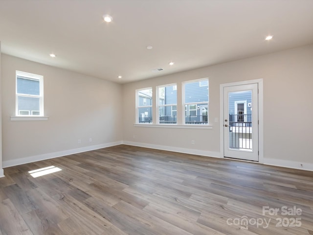 7004 Impulse Ct, Charlotte, NC 28205 - empty room featuring wood finished floors and recessed lighting